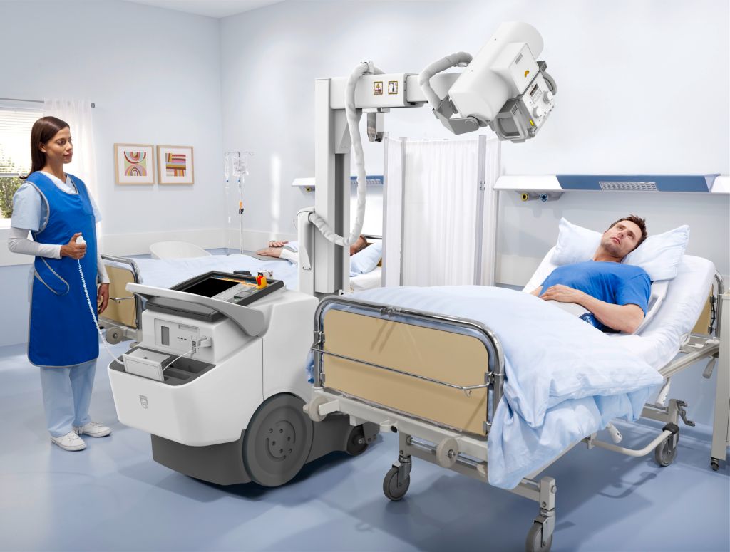 Sliding column and telescopic arm provide an outstanding positioning flexibility for use in constrained spaces and different anatomies