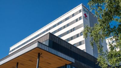 Oulu University Hospital building under blue sky