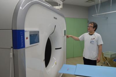 technologist with ct system