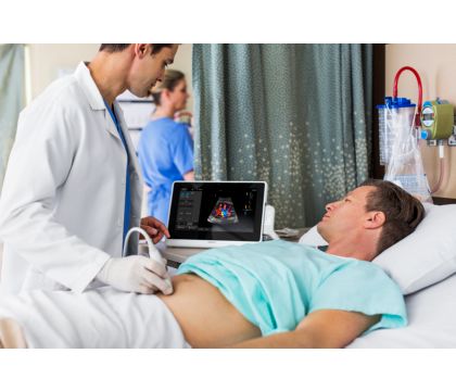 InnoSight patient bedside abdominal scan with doctor and patient, using C6-2 transducer