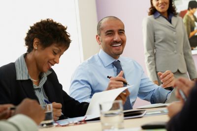 Smiling people at corporate learning session
