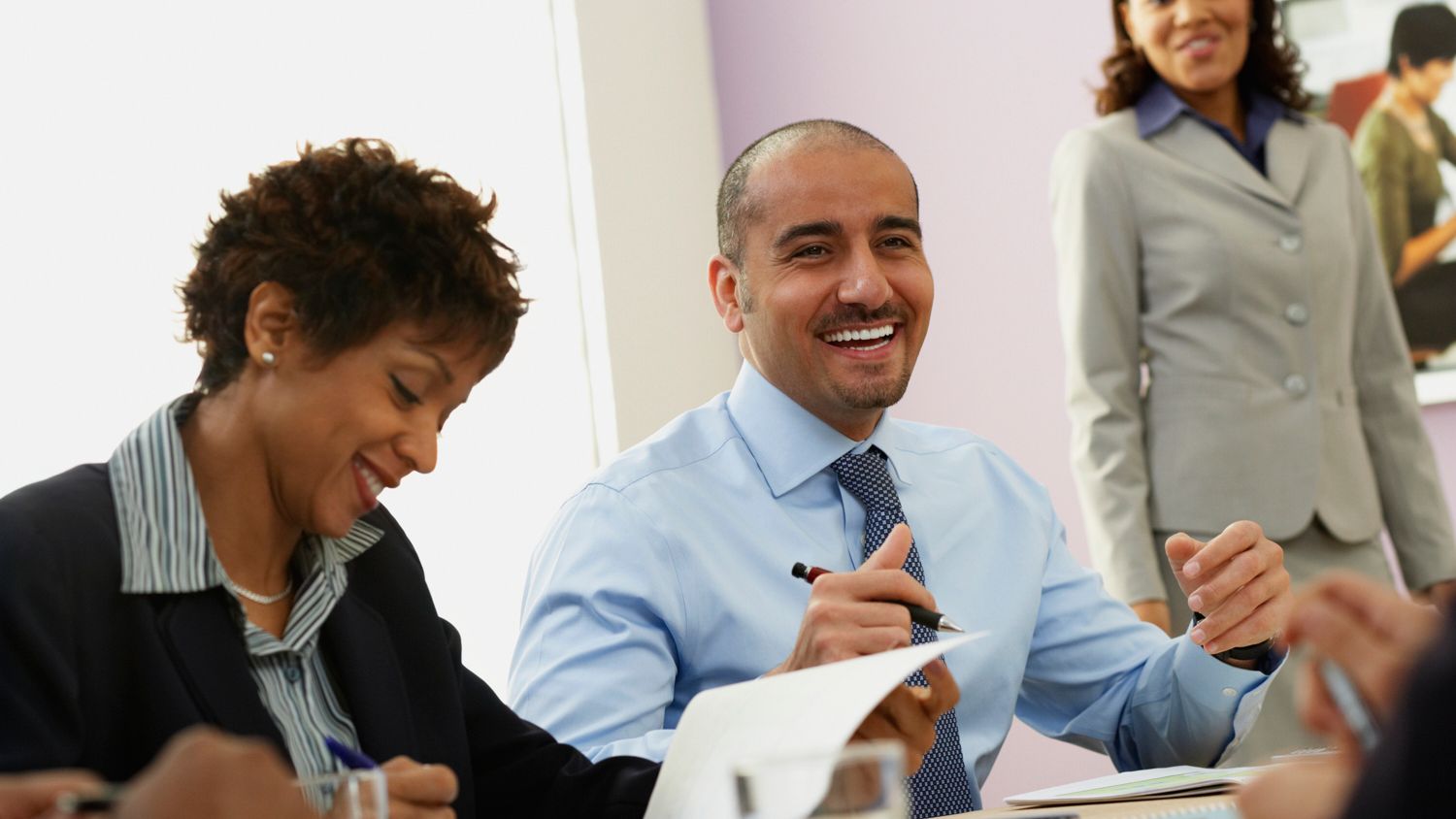 Smiling people at corporate learning session