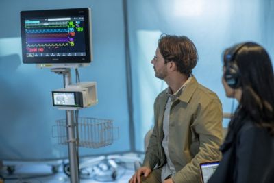 Patient and clinician observe Philips patient monitoring display in clinical setting