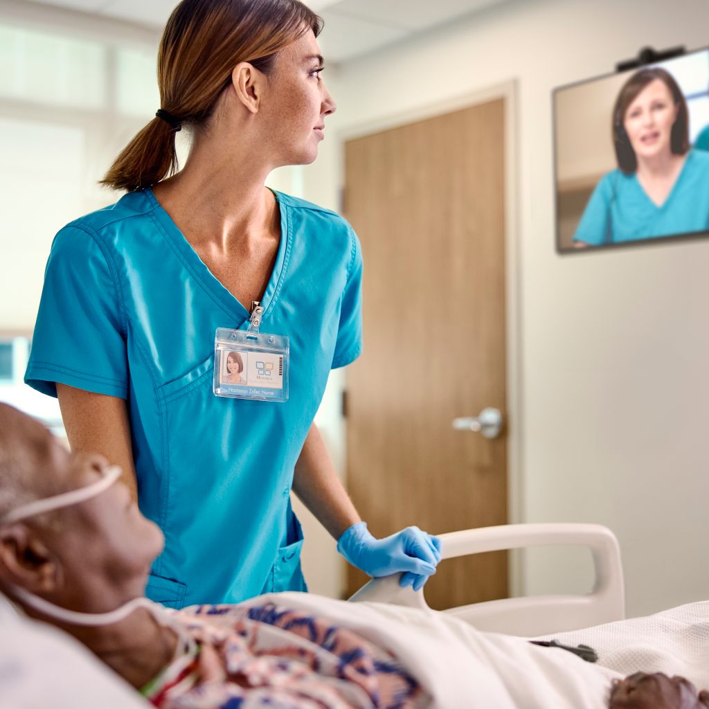 nurse and patient looking at virtual nurse on screen