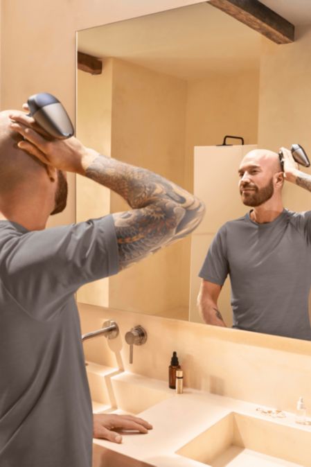 Philips Head Shaver for smooth, bald look in bathroom
