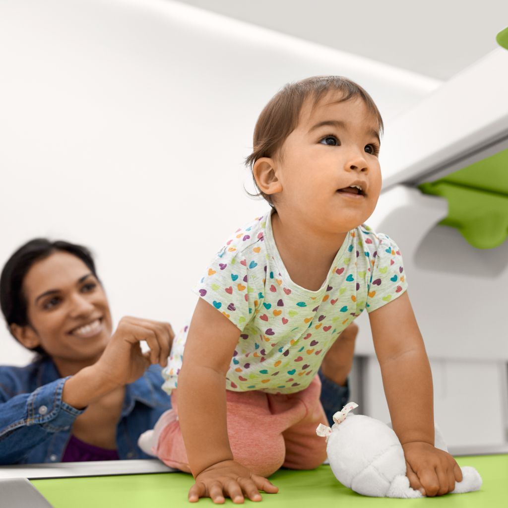 Child gets a pediatric foot exam on the ProxiDiagnost N90 with SkyPlate