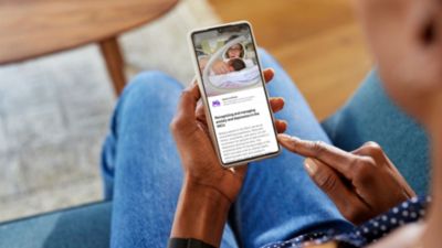 Person reading March of Dimes mental health content in Philips Avent Pregnancy plus app