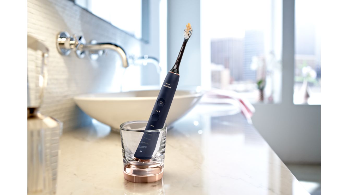 Philips Sonicare i forskellige farver i deres glasoplader
