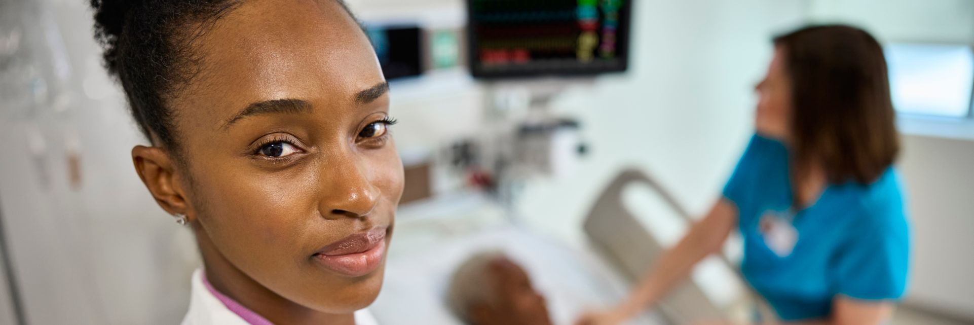 Doctor at bedside with Enterprise Viewer on iPad
