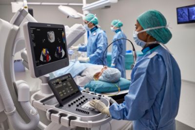 Cardiology team performing echocardiography procedure using advanced ultrasound system