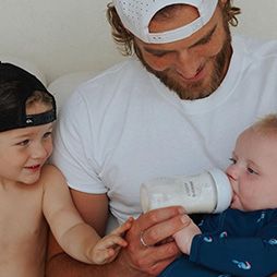 Dad bottle feeding