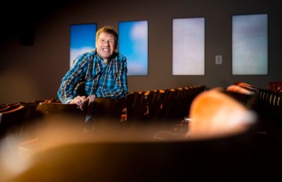 Mark Johnson standing in auditorium where innovation presentations take place