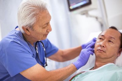 Doctor helping patient