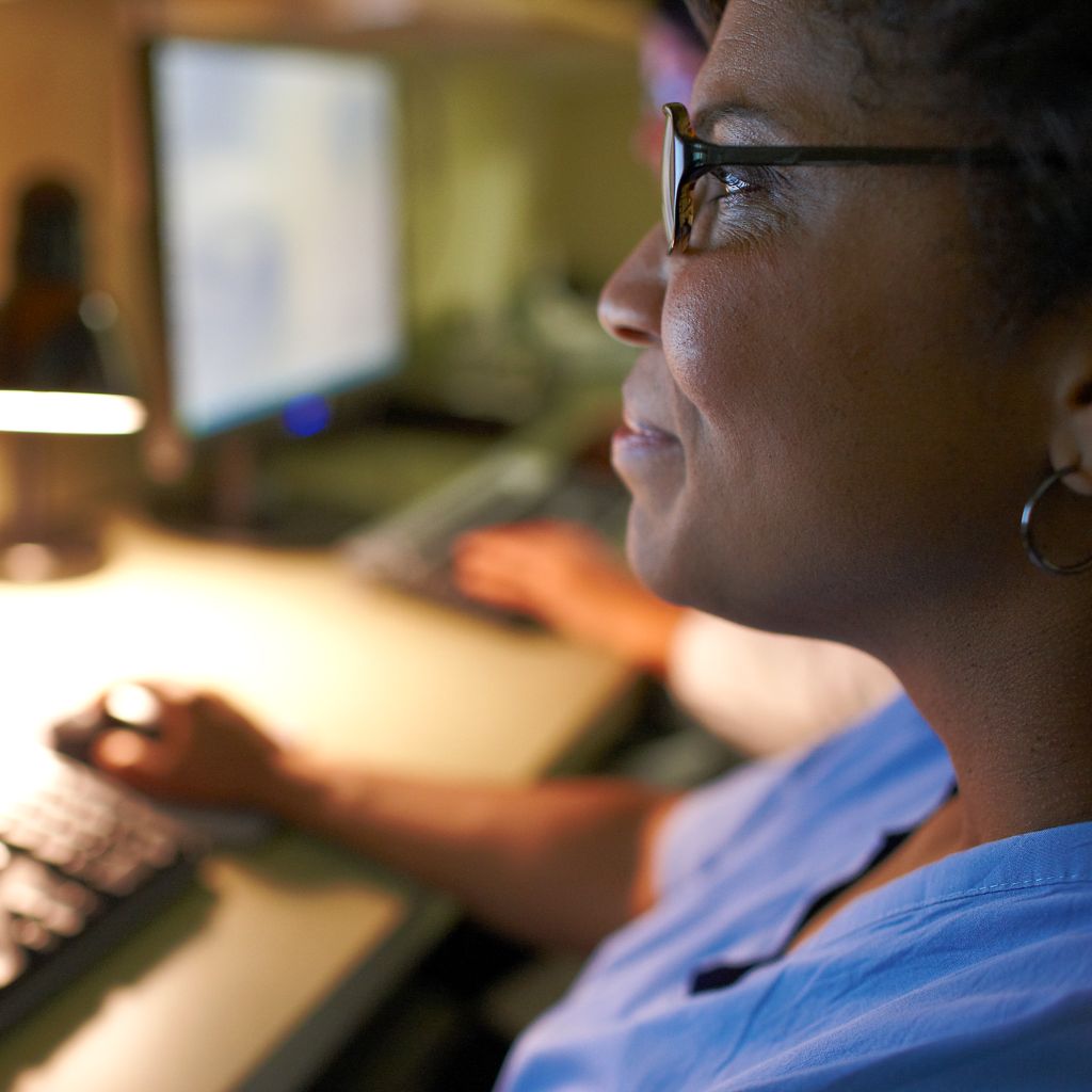 woman looking at computer screen