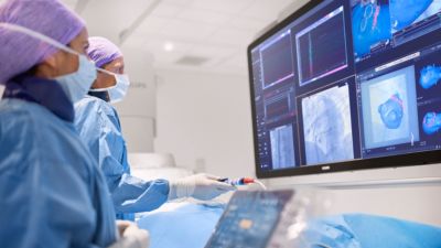 Clinical team performing procedure using Philips Azurion 7C20 with real time imaging guidance