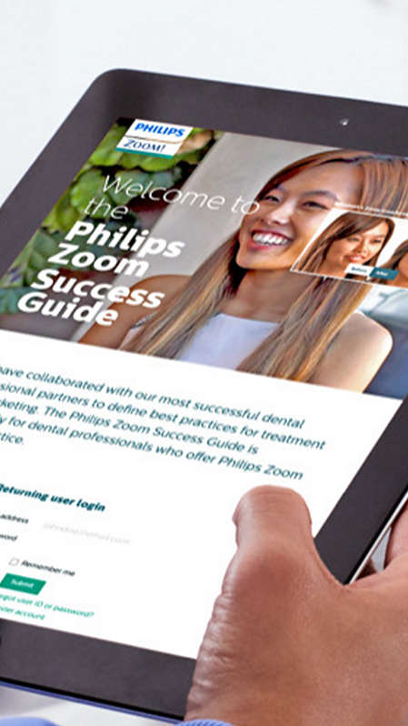 A dental professional looking at the Philips Zoom! Success Guide