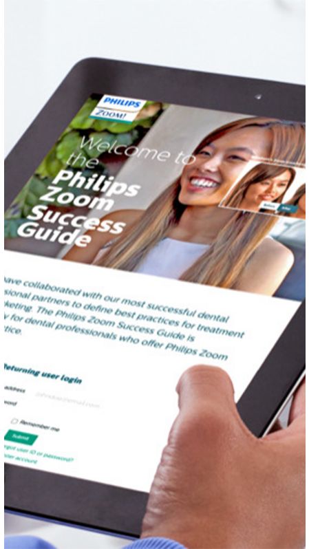 Dental professional holding a tablet showing Philips Zoom!