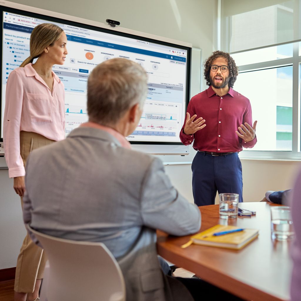 People in room with focal point on screen
