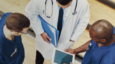 Healthcare professionals reviewing patient information together in hospital setting