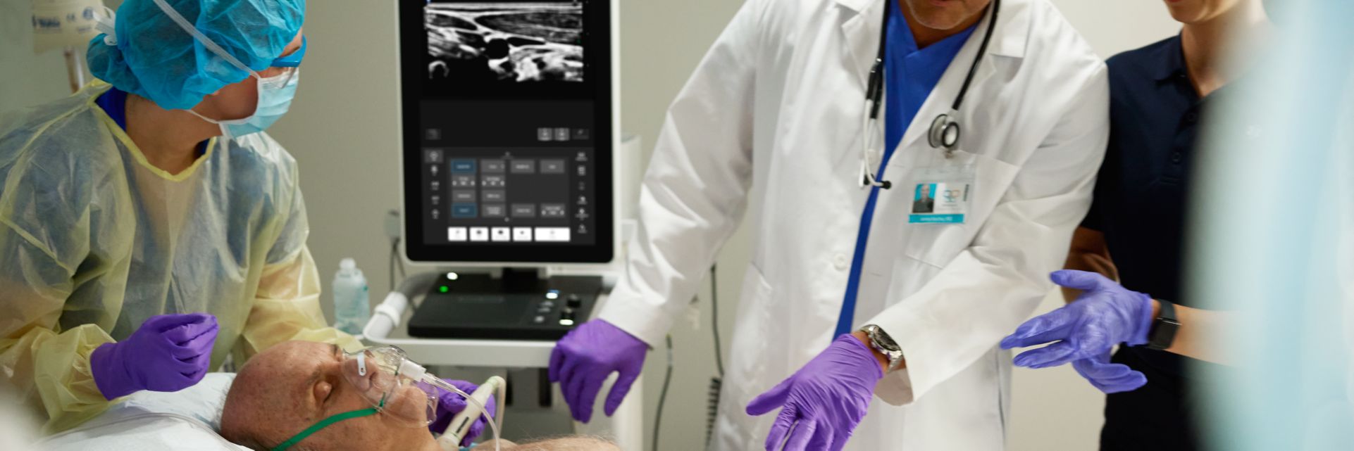 Patient in emergency medicine scene with clinicians overseeing care