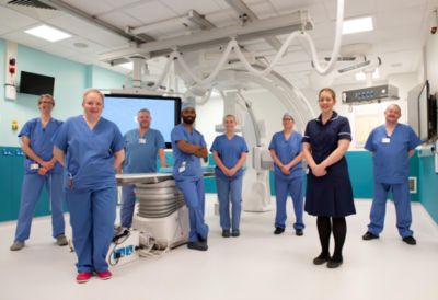 Medical and hospital staff with Philips interventional cardiology equipment at Leeds Teaching Hospitals NHS Trust
