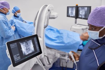 Surgical team performing urology procedure using Philips Zenition 30 in operating room
