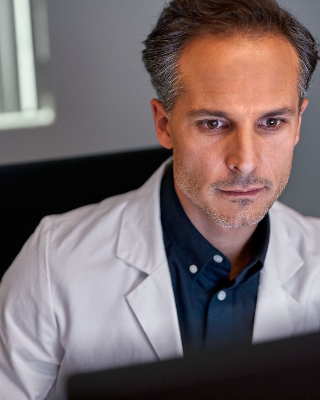 Radiologist looking at screen