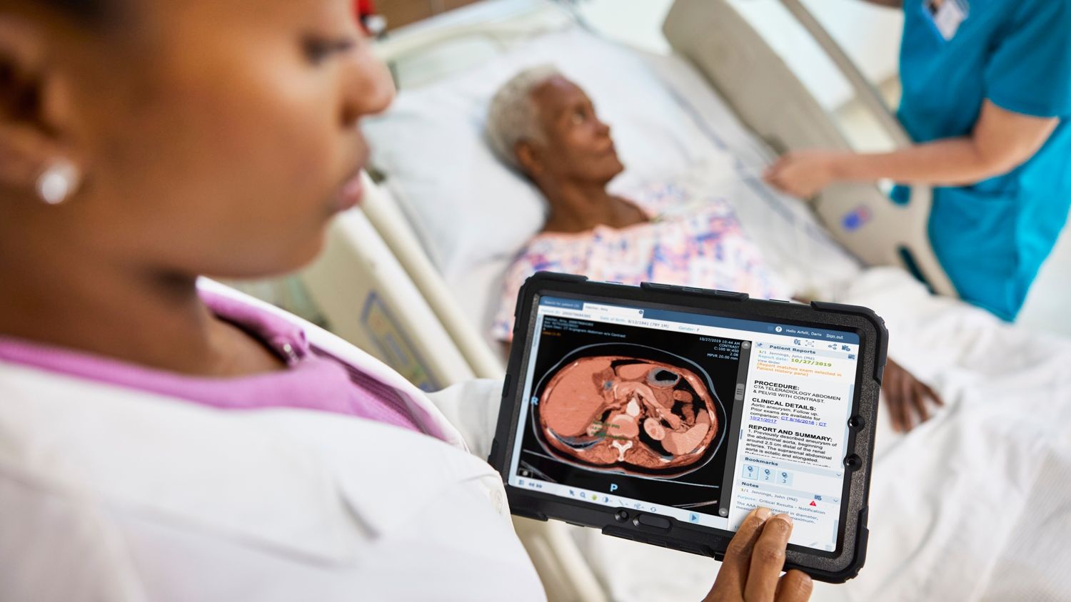 woman watching at tablet that shows medical image patient