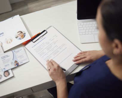 A dental professional looking at the Path to Health toolkit items