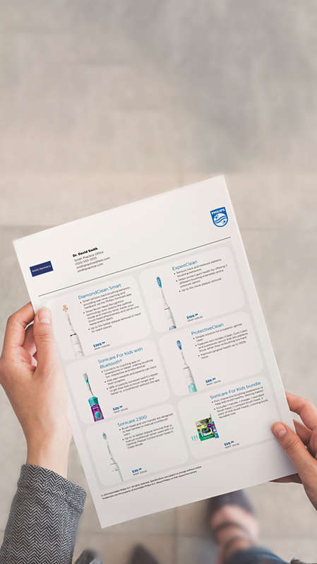 A dental professional holding a customized product sheet.