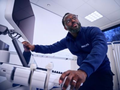 Field service engineer servicing ultrasound cart