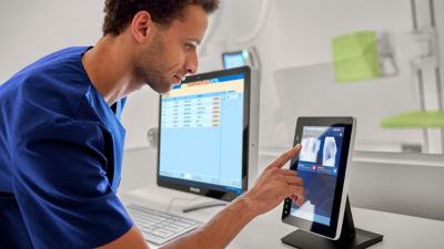 Radiologist male doctor examining medical images