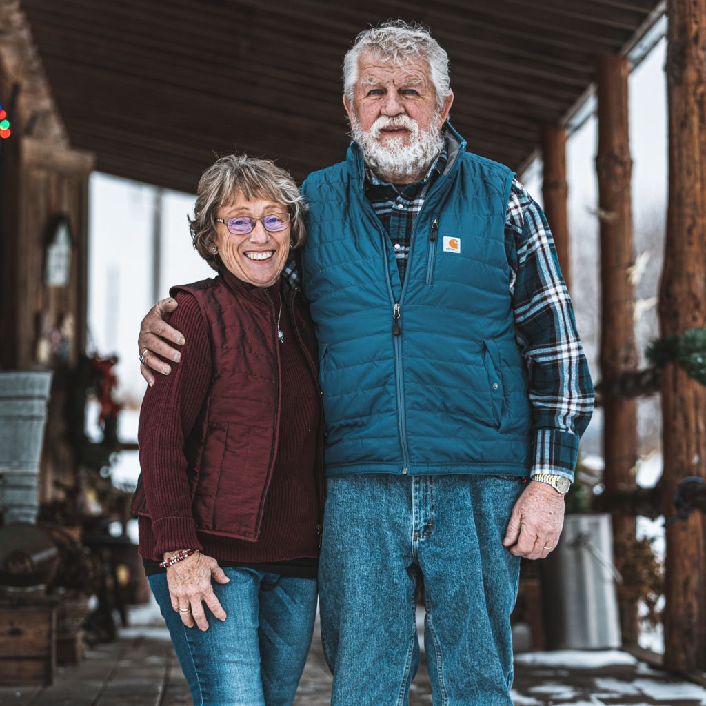 Bob and Elaine standing together outside their home