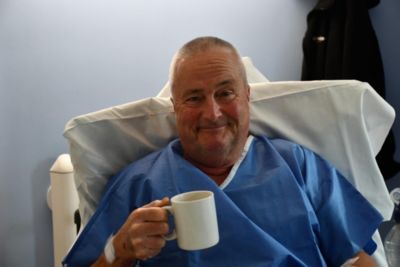Patient Michael Bronze, sitting in the day ward at Royal Papworth Hospital after his procedure