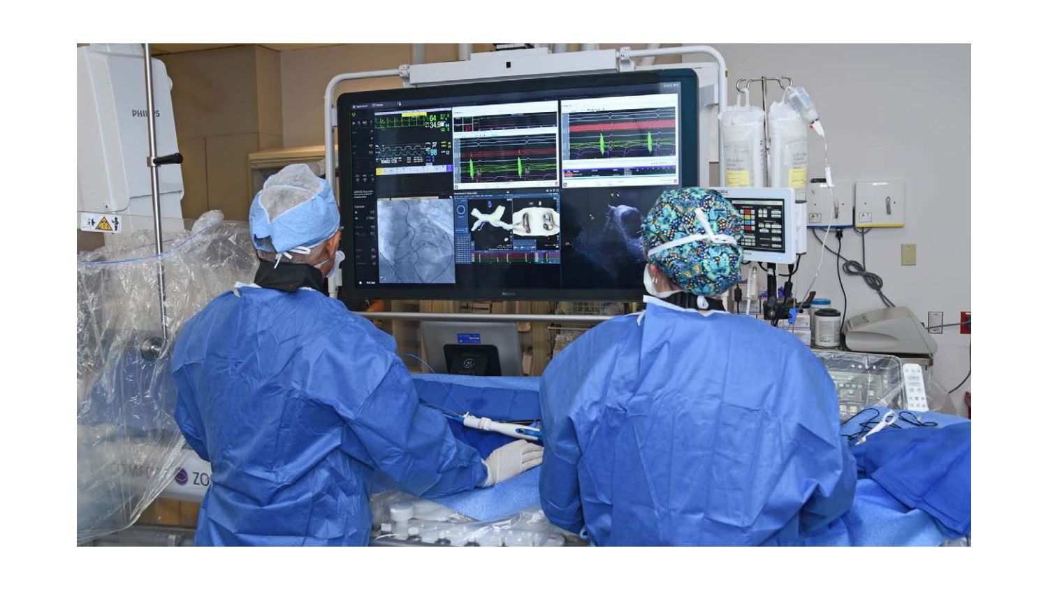 Physician performing surgery in an EP suite