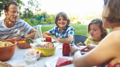 Family enjoying outdoor meal together