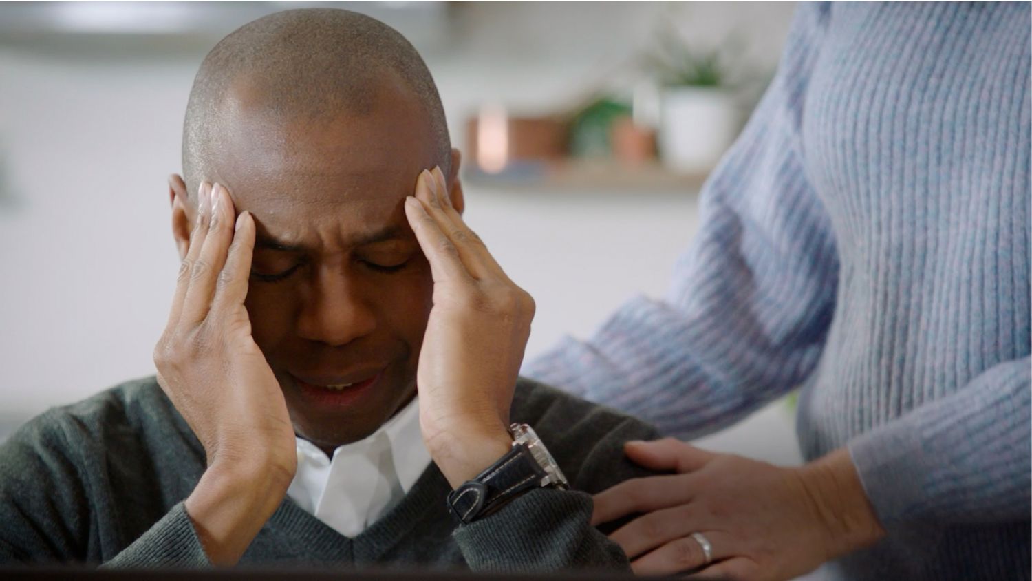 Man rubbing his temples