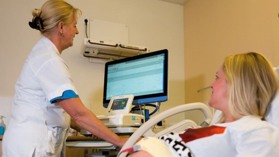 Staff in in a room with the patient