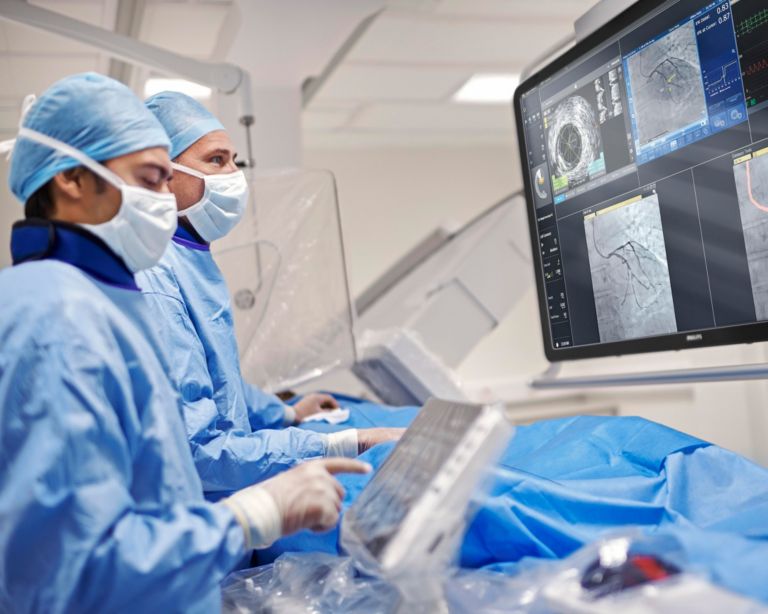 Physicians looking at IVUS
