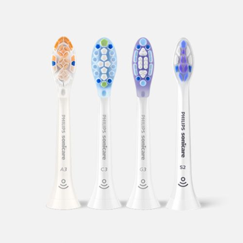 Sonicare power toothbrushes aligned on a countertop