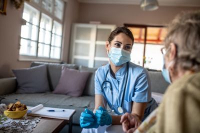 Home Care Nurse with Elderly Patient