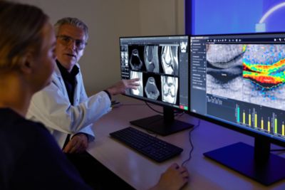 Clinician reviewing MRI images on Philips MR Workspace with SmartSpeed