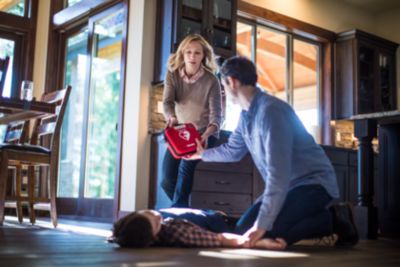 Parents using Philips HeartStart Home AED to respond to child during cardiac emergency at home