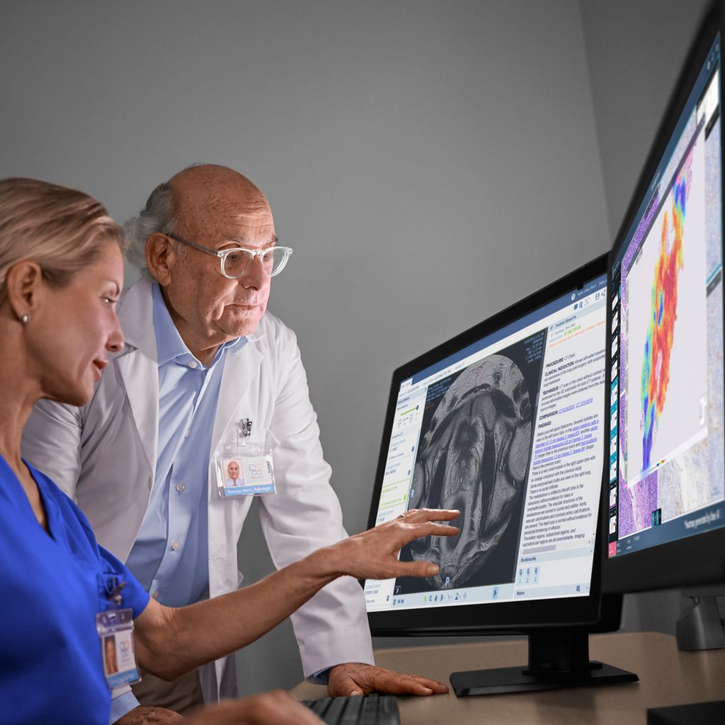 Pathologist and oncologist looking at scans