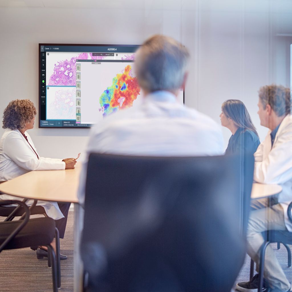 Doctors and Clinicians reviewing screen results.