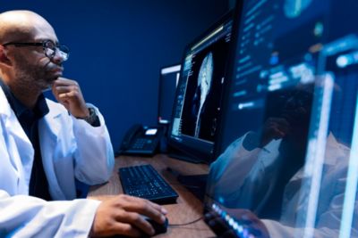 Clinician analyzes brain MRI on Philips radiology workstation
