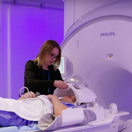 Laura Barlow preparing a patient for an MRI scan