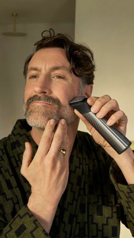 Man trimming beard using Philips All-in-One Trimmer 9000