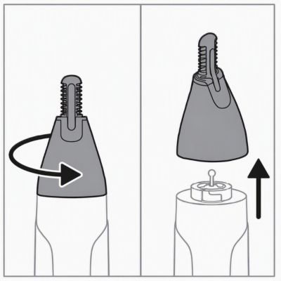Twisting the trimming head and lifting it off the handle