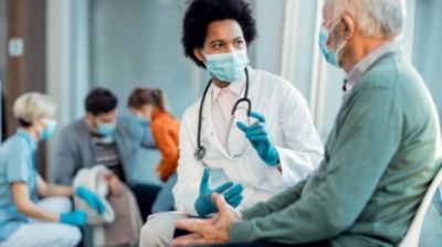 A doctor consults with a patient